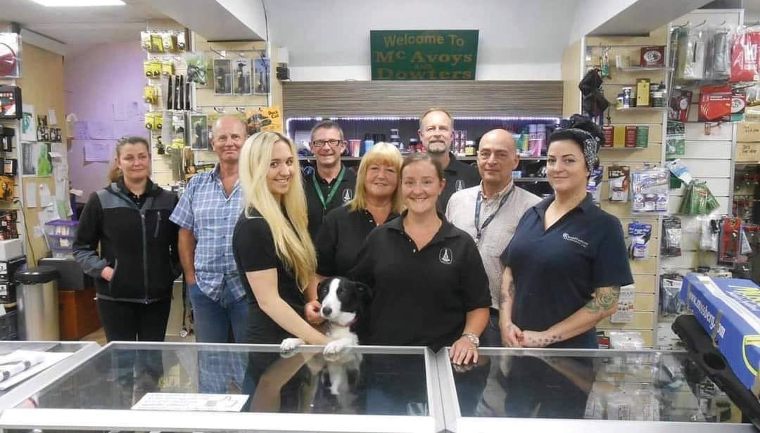 mcavoy employees and a display cabinet
