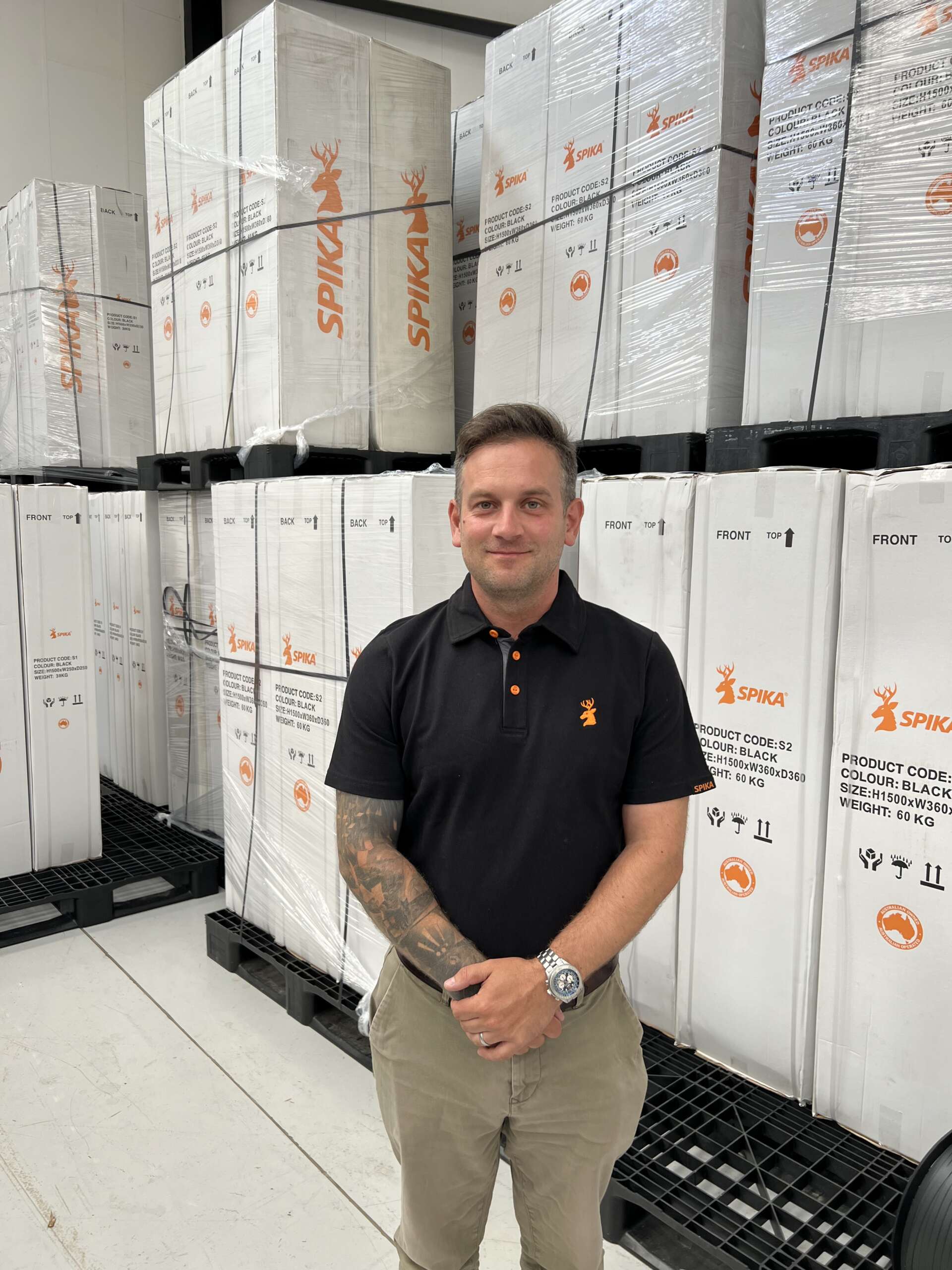 Tom Walker, manager of Eastern Sporting Trade, standing in the warehouse among newly arrived Spika gun safes, representing the brand’s UK launch.